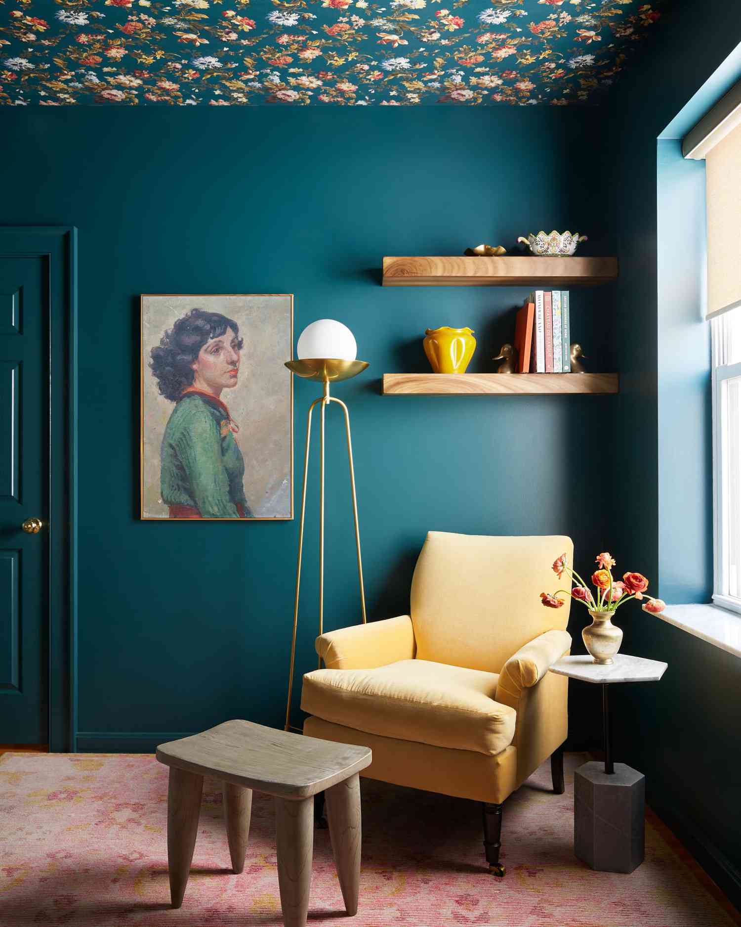 Finished bedroom with richly patterned wallpaper accent wall