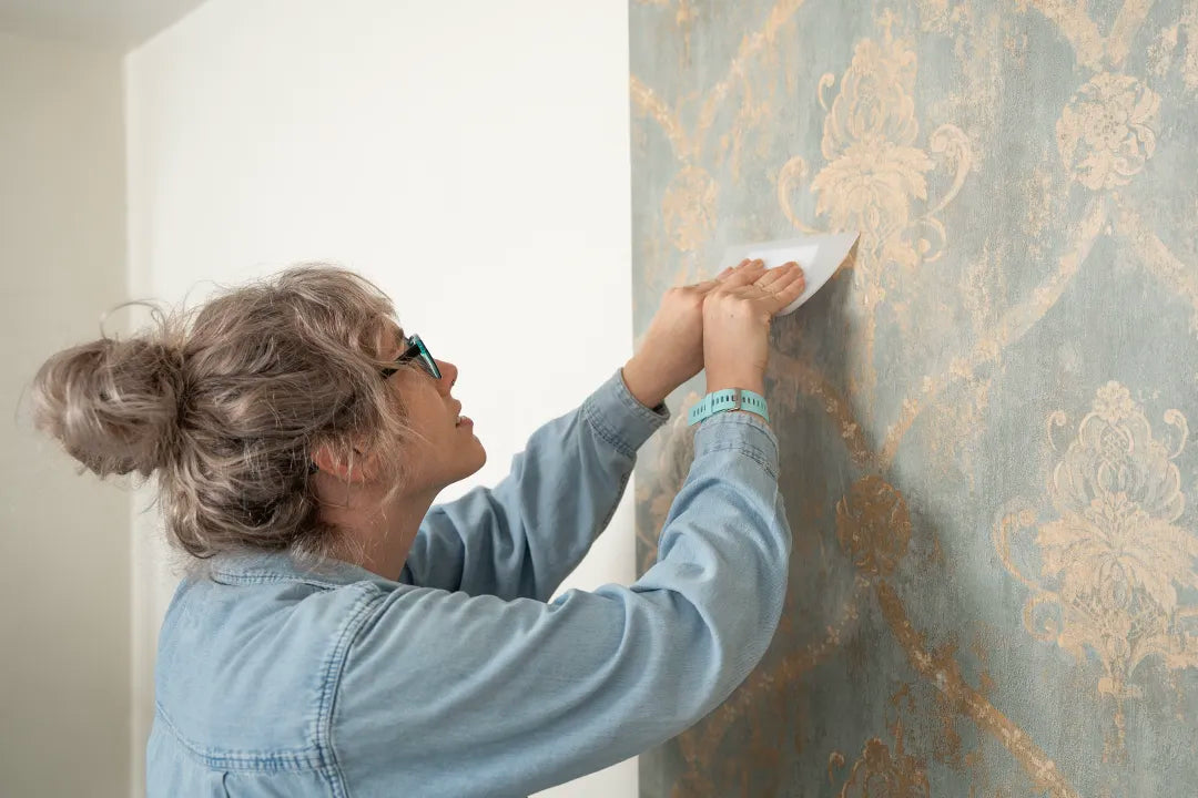 Careful wallpaper installation in progress